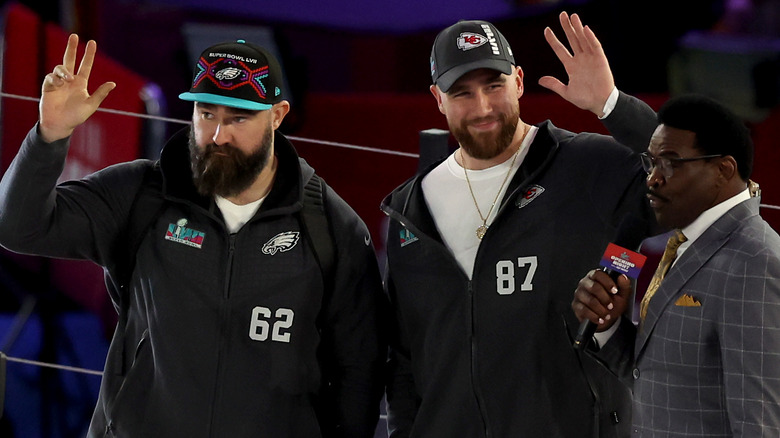 Jason Kelce and Travis Kelce waving