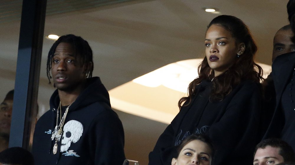 Travis Scott and Rihanna at a sporting event 