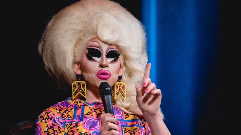 Trixie Mattel holding microphone