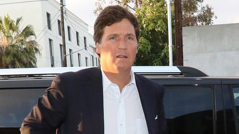 Tucker Carlson getting out of car