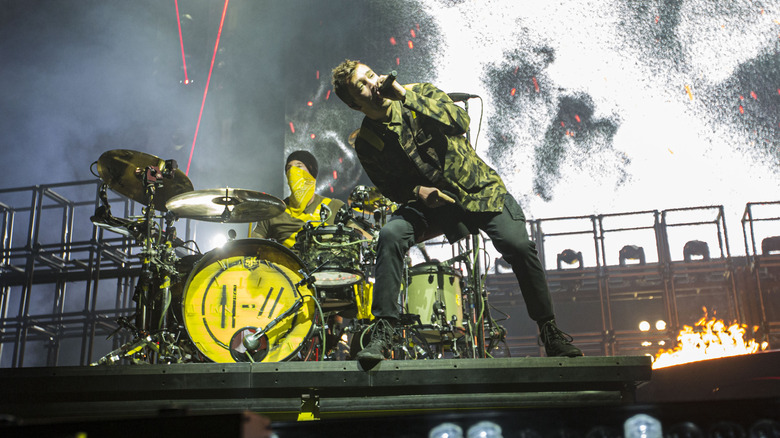 Twenty one pilots performing onstage 