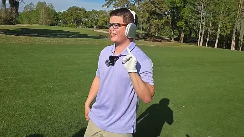 Sketch wearing headphones and playing golf