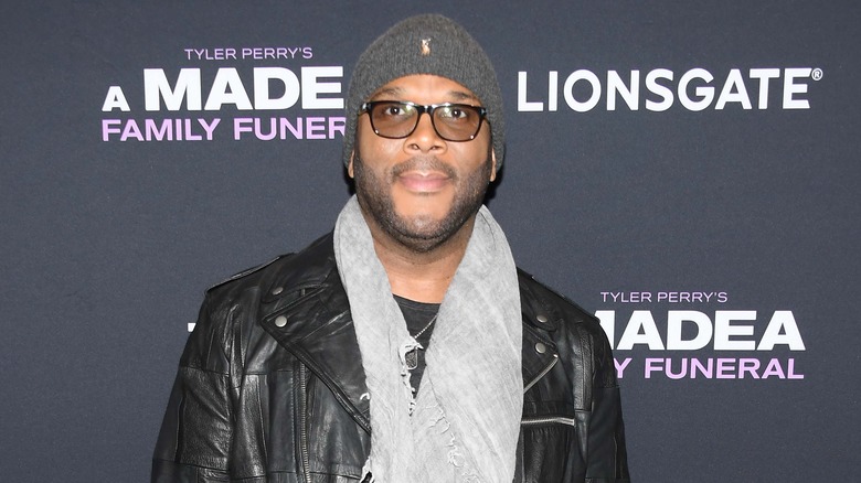 Tyler Perry posing at "A Madea Family Funeral" screening