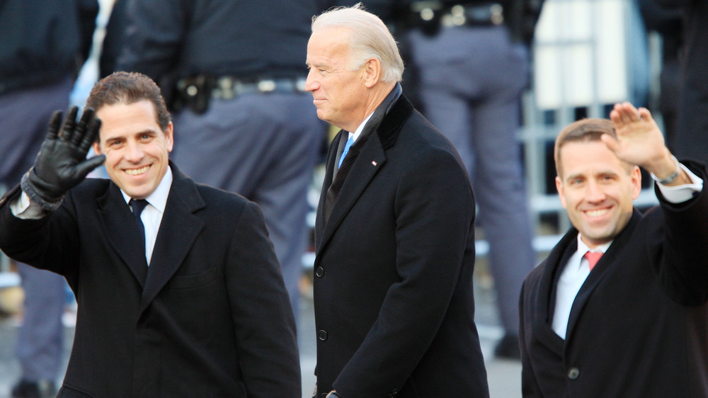 Joe Biden and sons Hunter and Beau Biden walking and waving