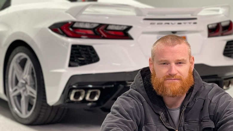 Wes Bergmann poses with Corvette