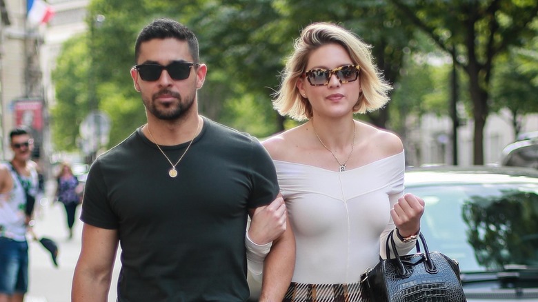 Wilmer Valderrama and Amanda Pacheco arm in arm