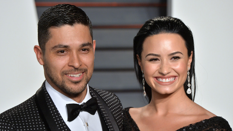 Wilmer Valderrama and demi lovato smile