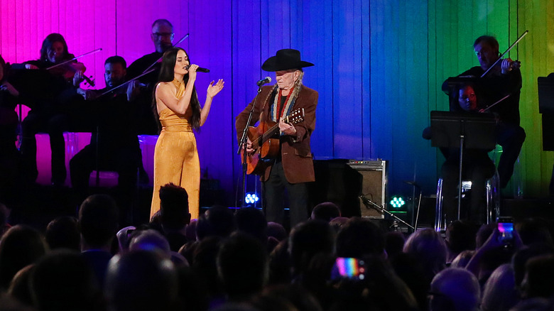 Kacey Musgraves performing with Willie Nelson