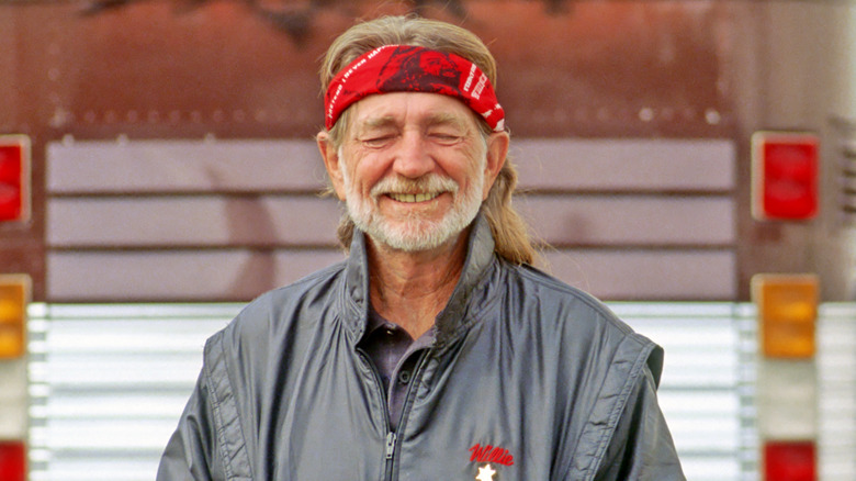 Willie Nelson smiling with eyes closed 