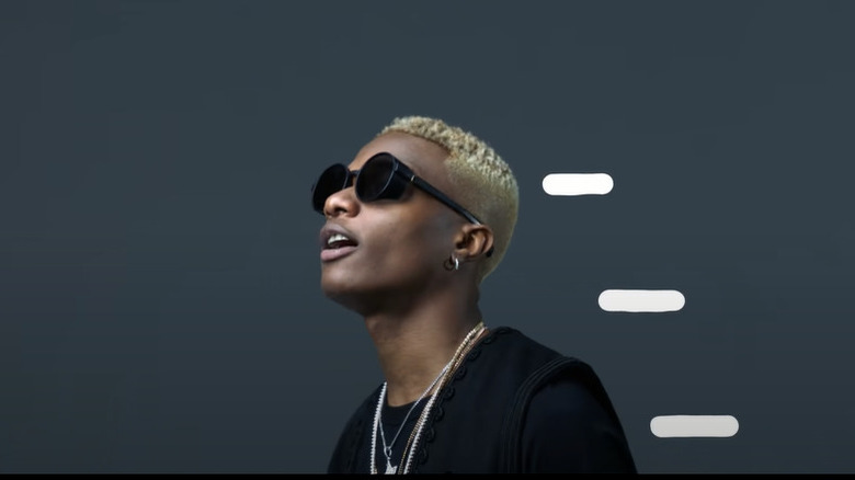 Wizkid turned to the side, mouth open