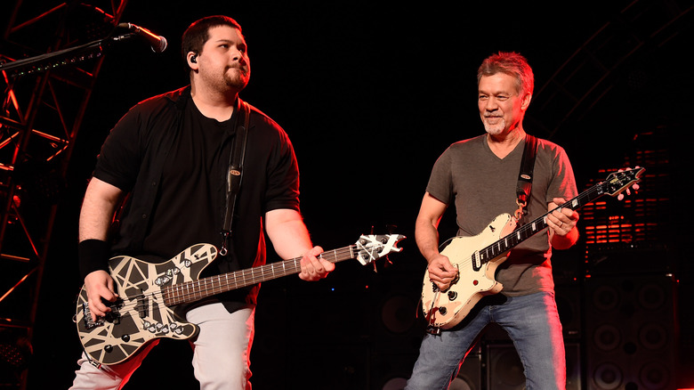 Wolf Van Halen and Eddie Van Halen onstage playing guitar