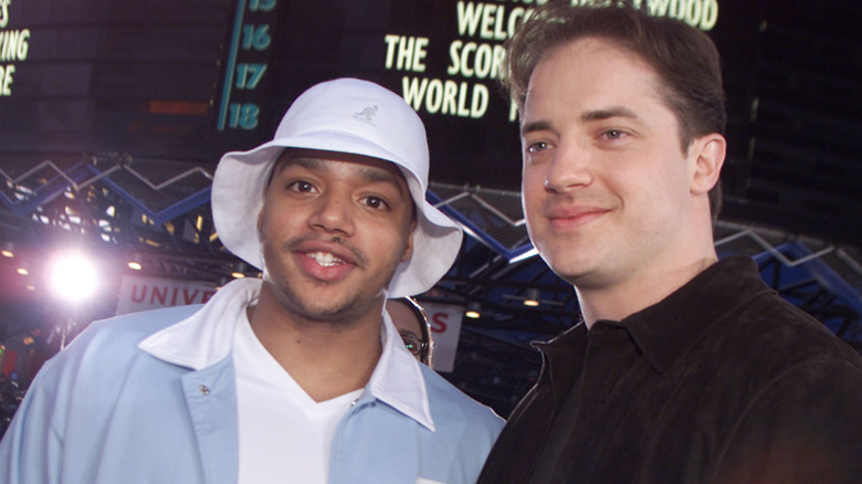 Donald Faison posing with Brendan Fraser in 2002