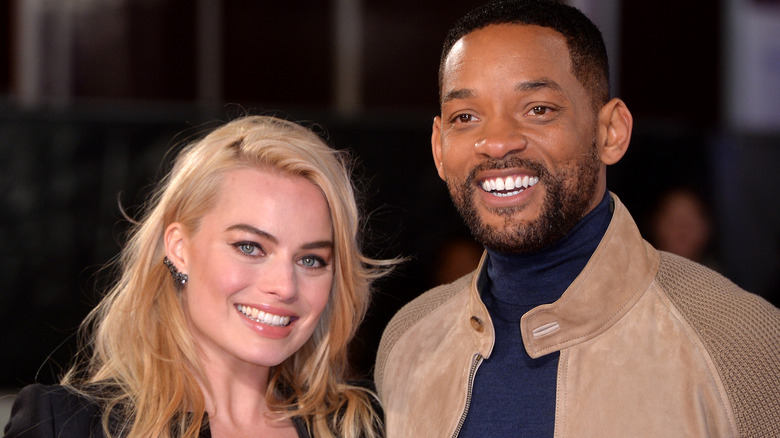 Margot Robbie and Will Smith smiling