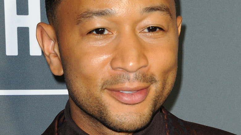 John Legend smiles on the red carpet