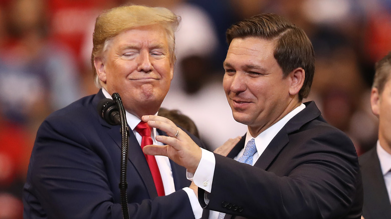 Donald Trump and Ron DeSantis smiling