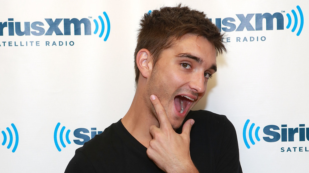 Tom Parker smiling big