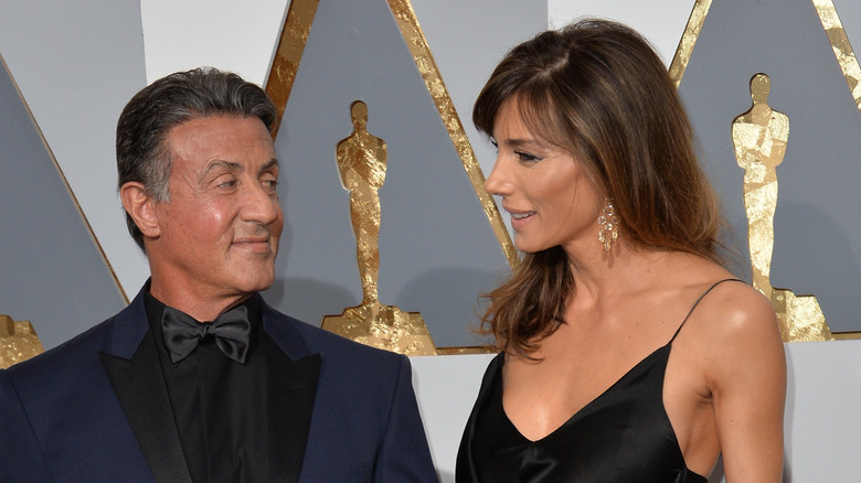 Sylvester Stallone smiling at wife Jennifer Flavin