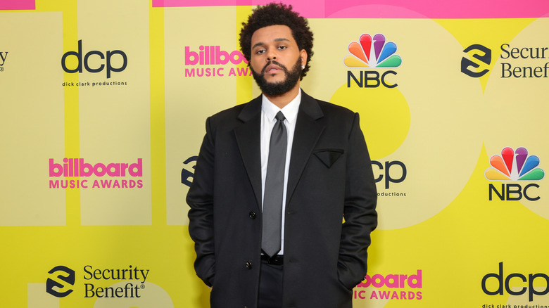 The Weeknd poses backstage for the 2021 Billboard Music Awards