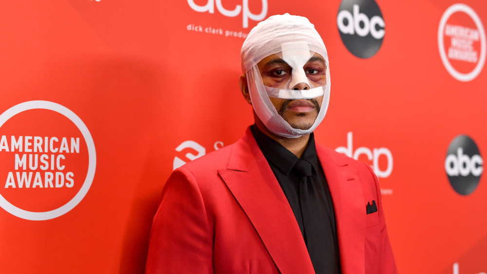 The Weeknd posing at the AMAs