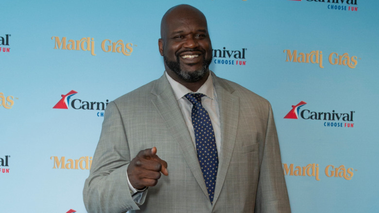 Shaquille O'Neal pointing and smiling 