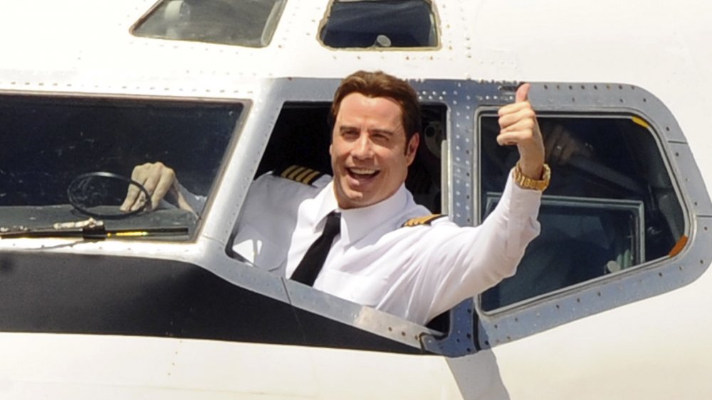 John Travolta in the cockpit of a huge jet 