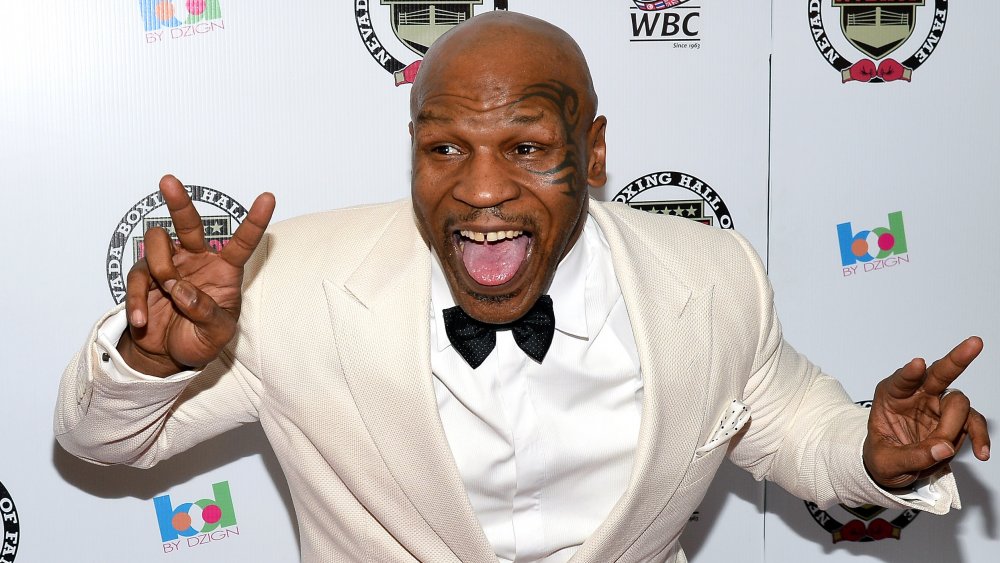 Mike Tyson making a silly face on red carpet