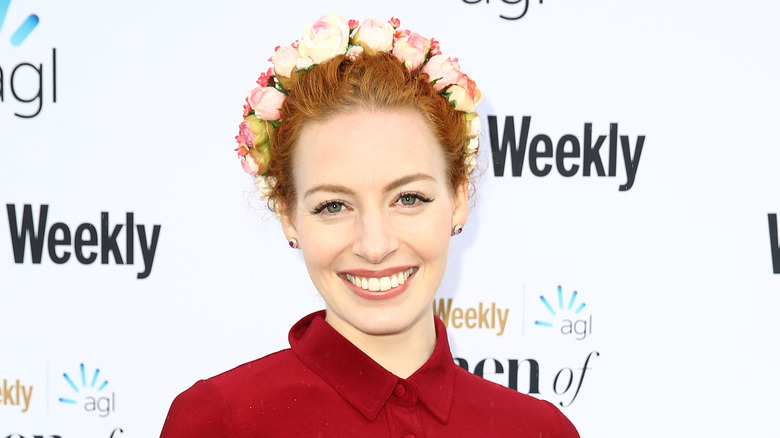 Emma Watkins smiling with floral crown 