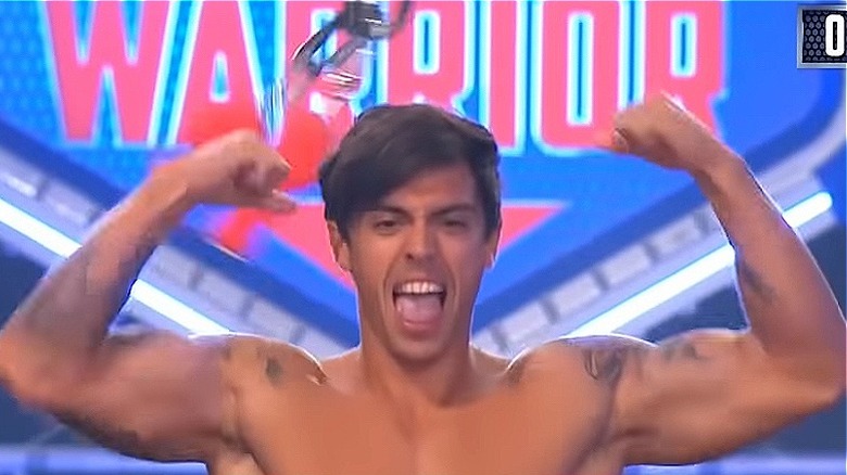 John Pearce showing muscles in American Ninja Warrior