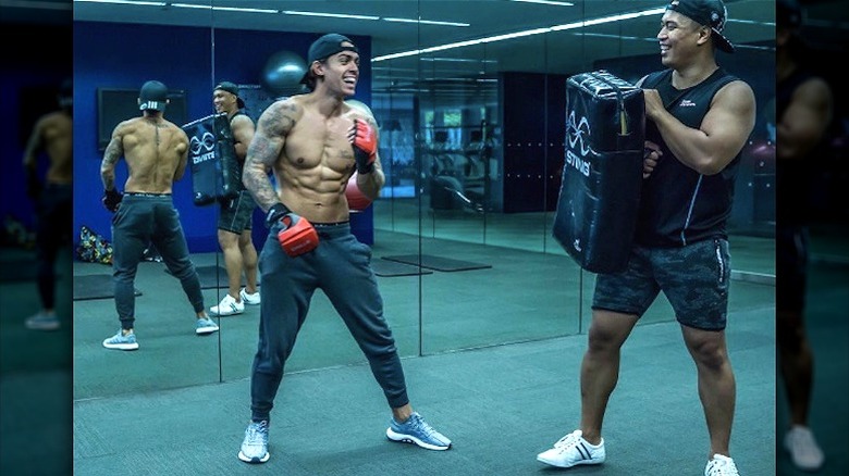 John Pearce working out with a friend