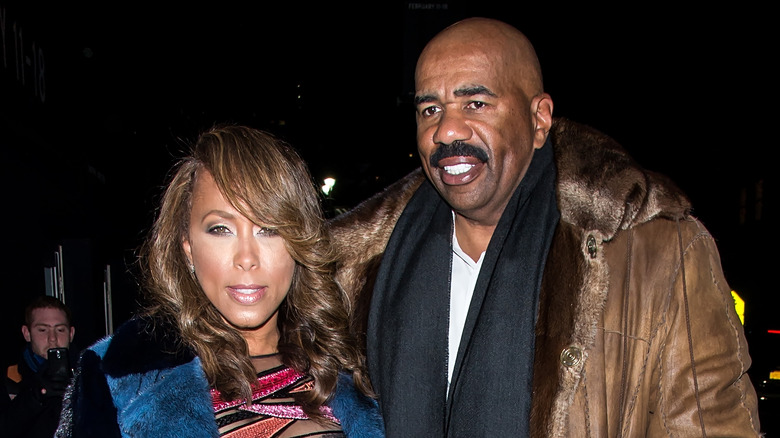 Steve Harvey and Marjorie Harvey walking