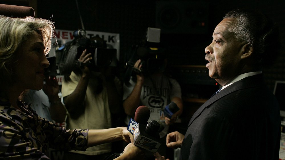 Al Sharpton speaking to reporters 