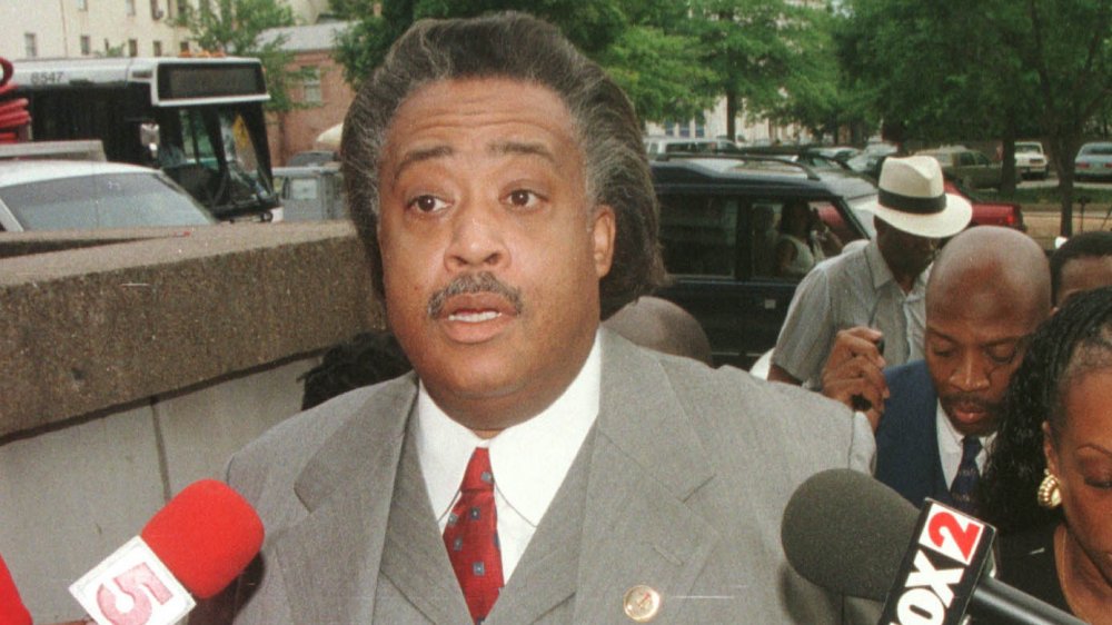 Al Sharpton addressing reporters 