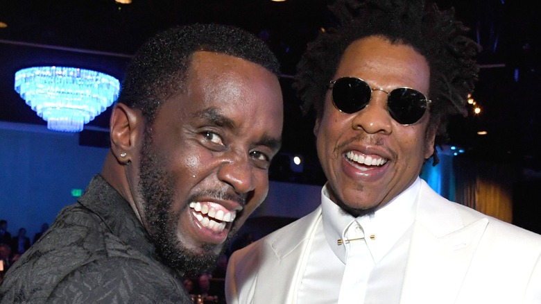 Diddy Jay-Z suits laughing together