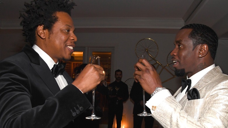 Jay-Z Diddy toasting with champagne