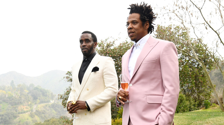 Jay-Z Diddy wearing suits champagne