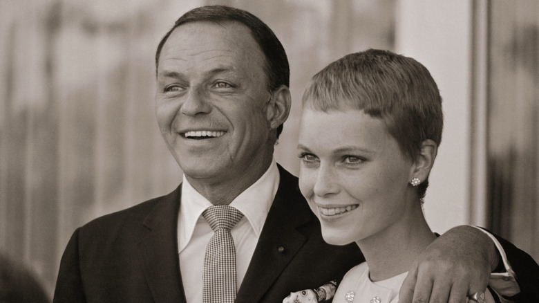 Frank Sinatra poses with Mia Farrow