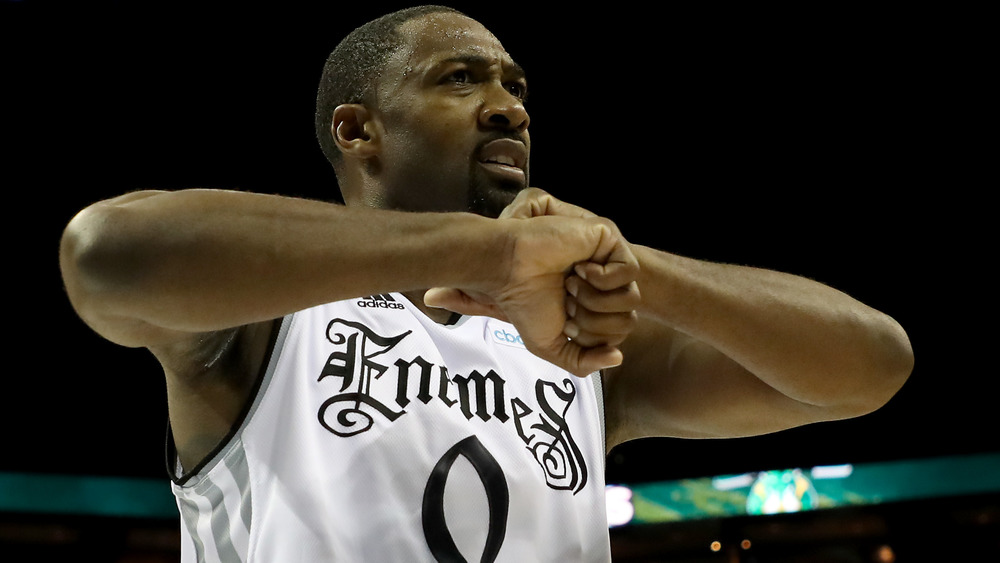 Gilbert Arenas looking frustrated a basket court