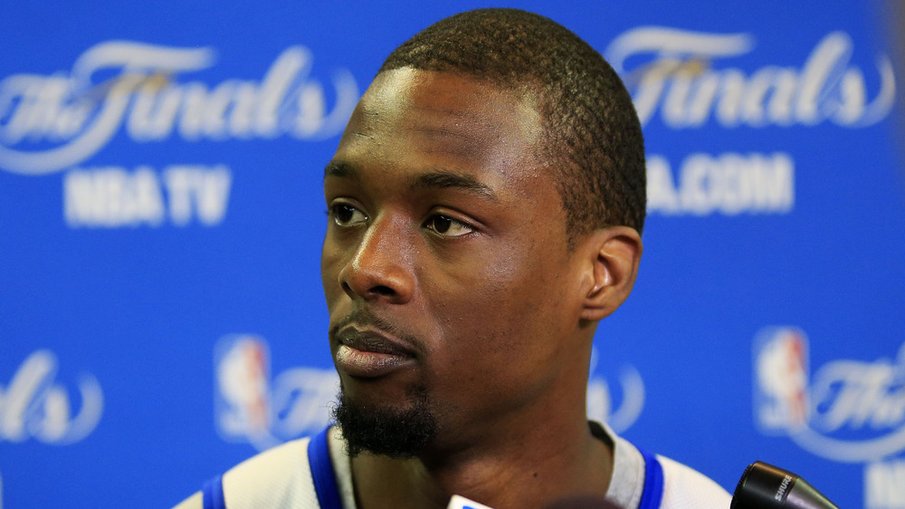 Harrison Barnes looks stage left at a press conference