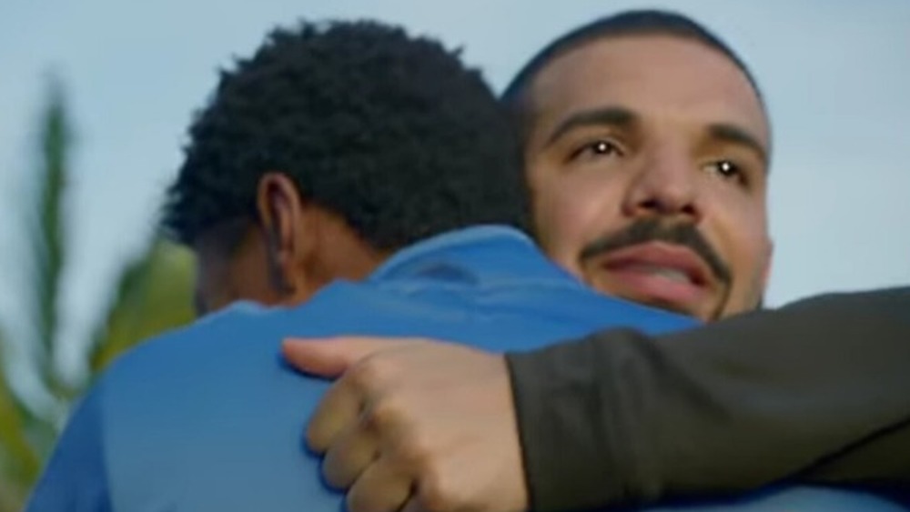 Drake shares embrace after good deed in God's Plan video