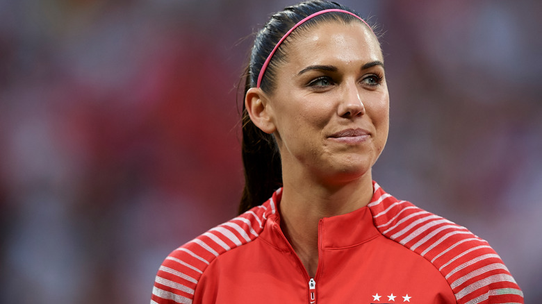 Alex Morgan looking away, smiling