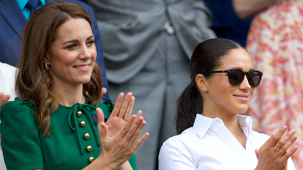 Kate Middleton, Meghan Markle, and Pippa Middleton clapping