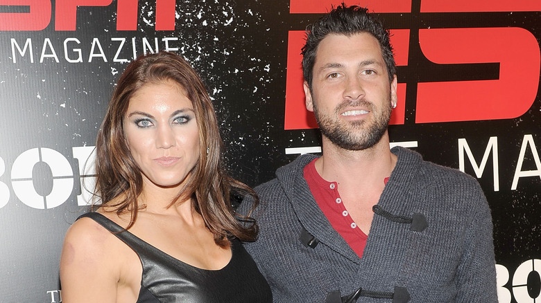 Hope Solo and Maksim Chmerkovskiy posing