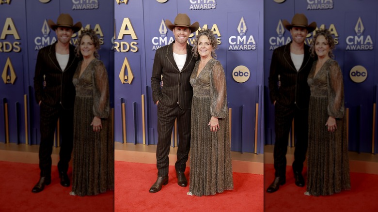 Dustin Lynch smiling with Patti Lynch at the 2024 CMA Awards