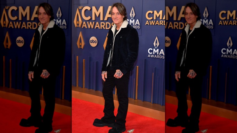 Keith Urban wearing a black ensemble at the 2024 CMA Awards