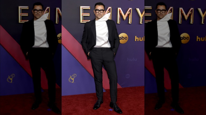 Dan Levy posing