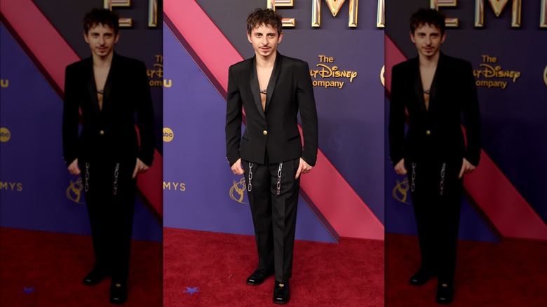 Moisés Arias wearing black suit