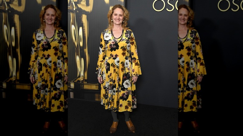 Melissa Leo wearing a floral yellow dress