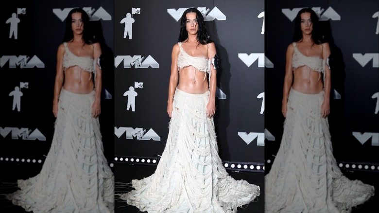 Katy Perry wearing white shredded top, skirt