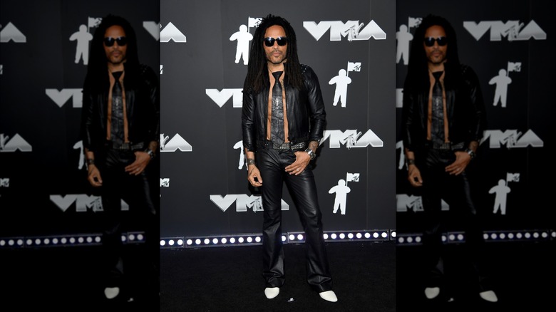 Lenny Kravitz posing with thumb in pocket