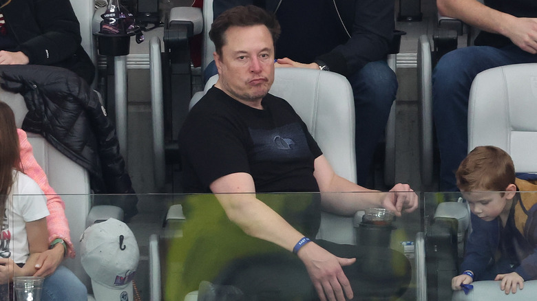 Elon Musk pouting black T-shirt